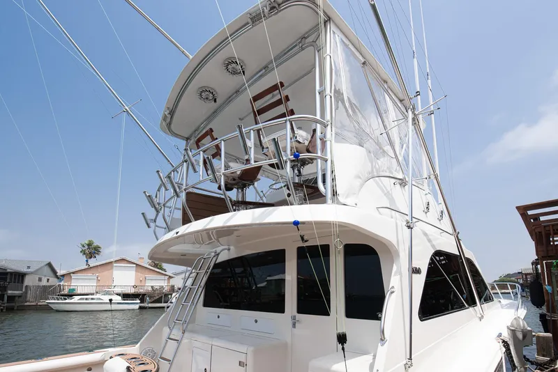Slide: The Image of 2002 Cabo Convertible Painted yacht docked at marina. - 5