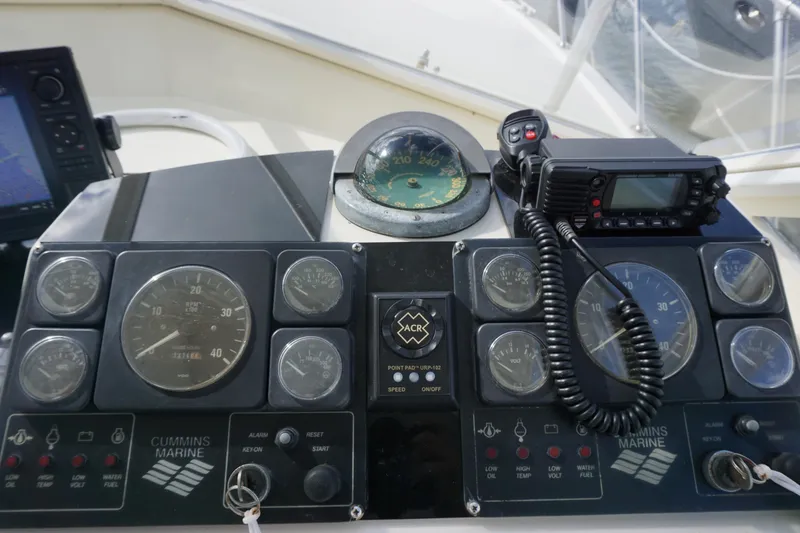 Slide: The Image of Control panel of a 1985 Hatteras 36 Convertible boat with Cummins Marine gauges. - 31