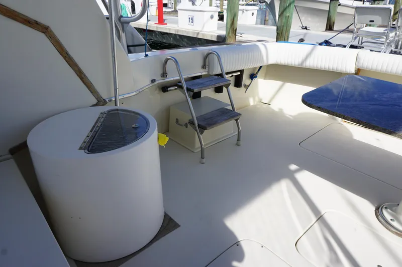 Slide: The Image of Cockpit area of 1985 Hatteras 36 Convertible yacht with seating and ladder. - 41