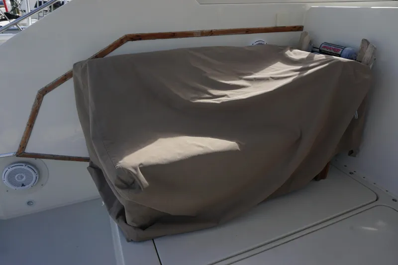 Slide: The Image of Covered seating area on a 1985 Hatteras 36 Convertible boat. - 44