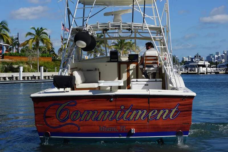 Slide: The Image of 1985 Hatteras 36 Convertible boat named Commitment in Miami, Florida marina. - 6