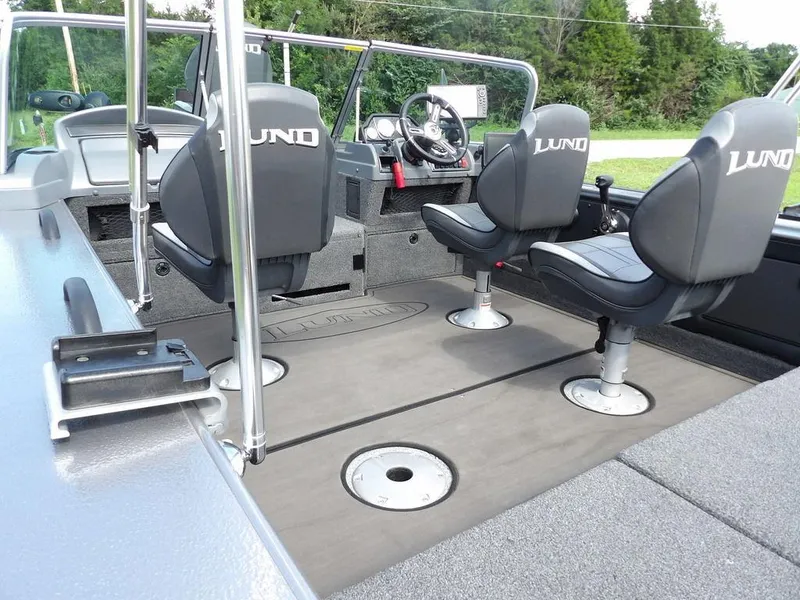 Slide: The Image of Interior of 2019 Lund 1975 Pro V Sport boat with seating and steering console. - 11