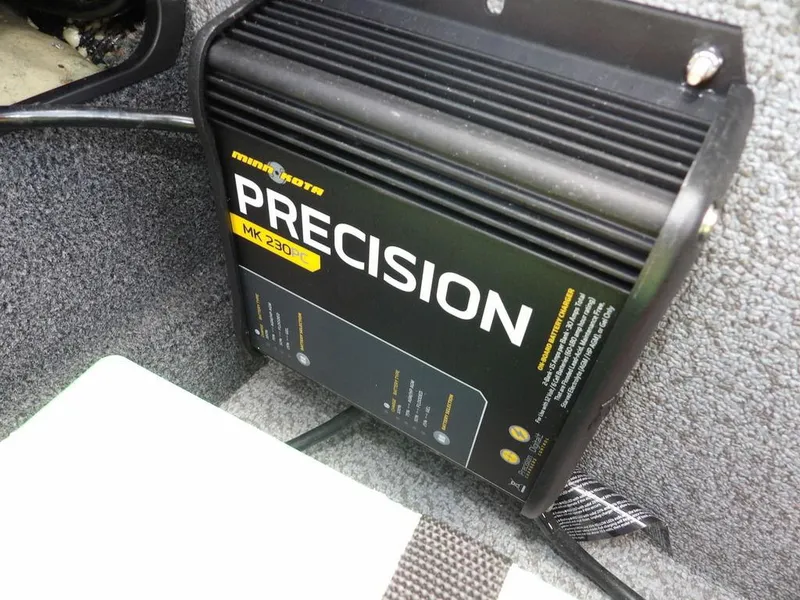 Slide: The Image of Minn Kota Precision MK 230PC charger installed in 2019 Lund 1975 Pro V Sport boat. - 15