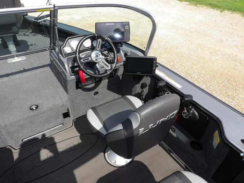 Slide: The Image of Interior of 2019 Lund 1975 Pro V Sport boat with steering wheel and electronics. - 18