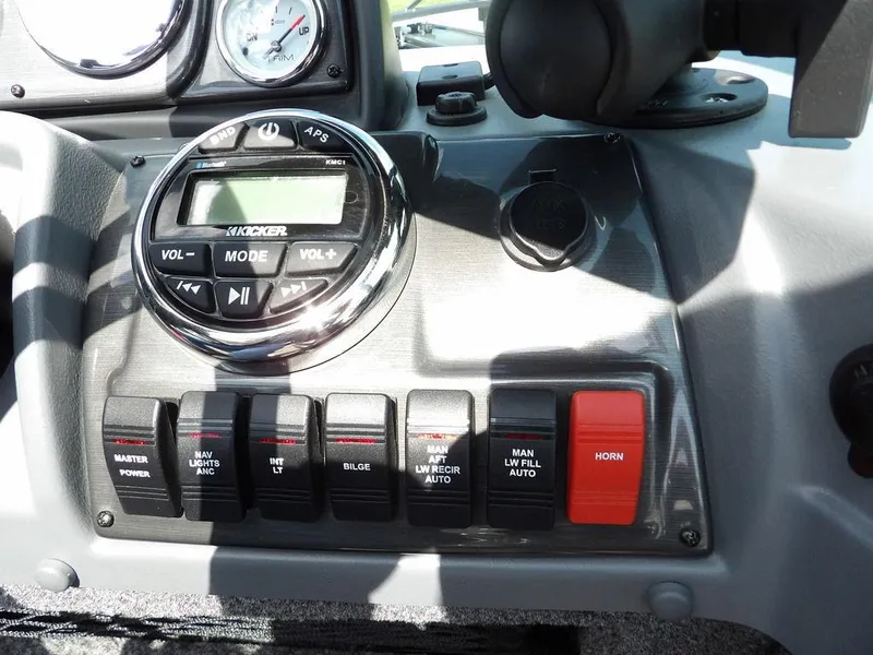Slide: The Image of Control panel of 2019 Lund 1975 Pro V Sport boat with switches and audio system. - 22