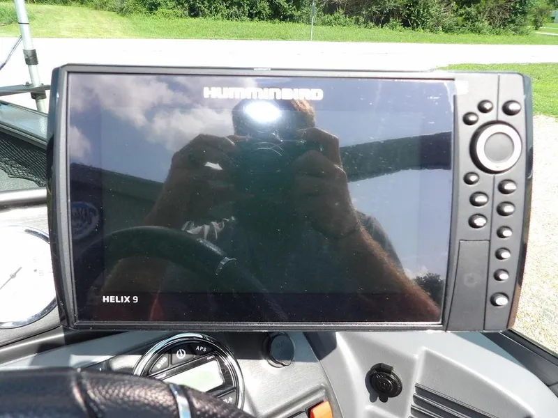 Slide: The Image of Humminbird Helix 9 fish finder on 2019 Lund 1975 Pro V Sport boat dashboard. - 24