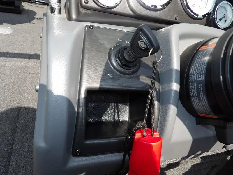 Slide: The Image of Dashboard of 2019 Lund 1975 Pro V Sport boat with ignition key and safety lanyard. - 28