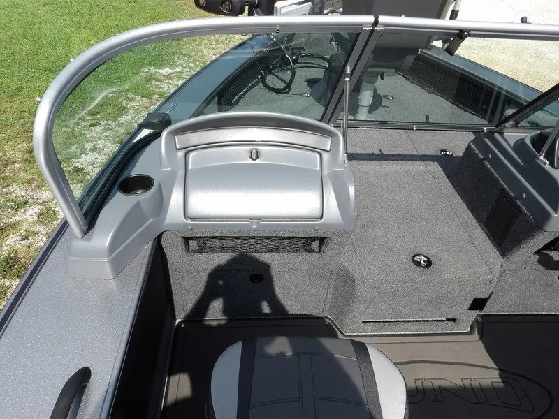 Slide: The Image of 2019 Lund 1975 Pro V Sport boat interior with seating and storage compartments. - 29