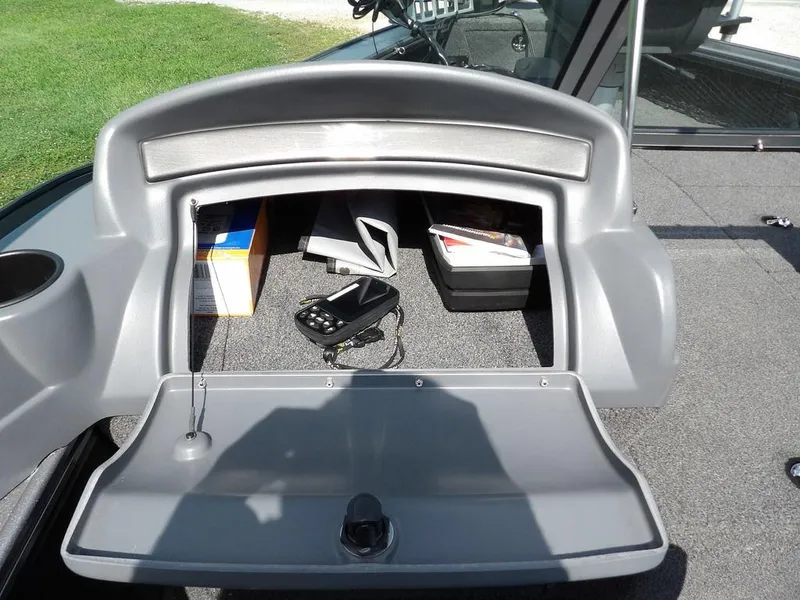 Slide: The Image of 2019 Lund 1975 Pro V Sport boat storage compartment with electronic device and accessories. - 33