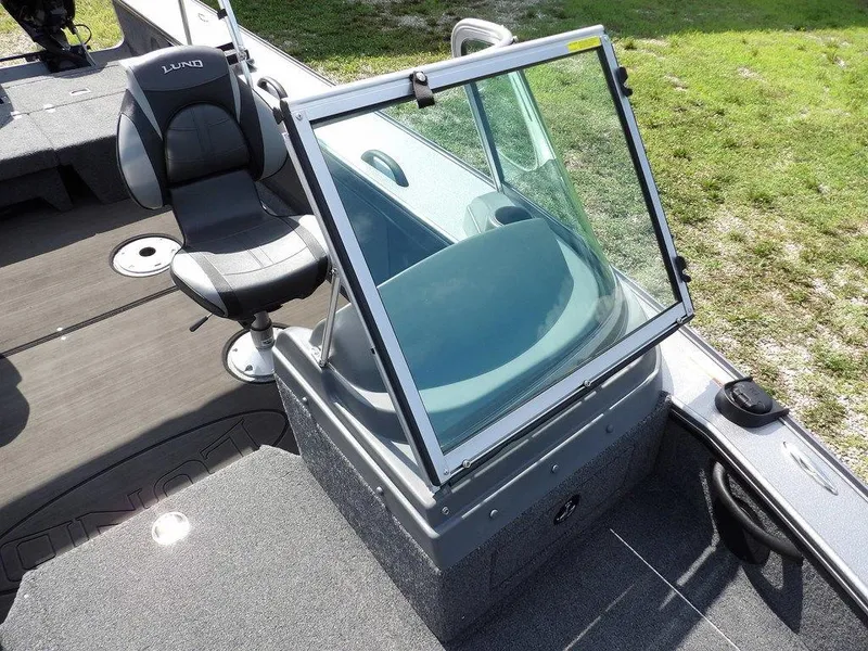 Slide: The Image of 2019 Lund 1975 Pro V Sport boat interior with seating and windshield. - 36