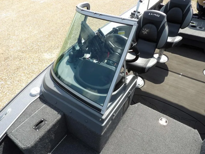 Slide: The Image of 2019 Lund 1975 Pro V Sport boat interior with steering console and seating. - 38