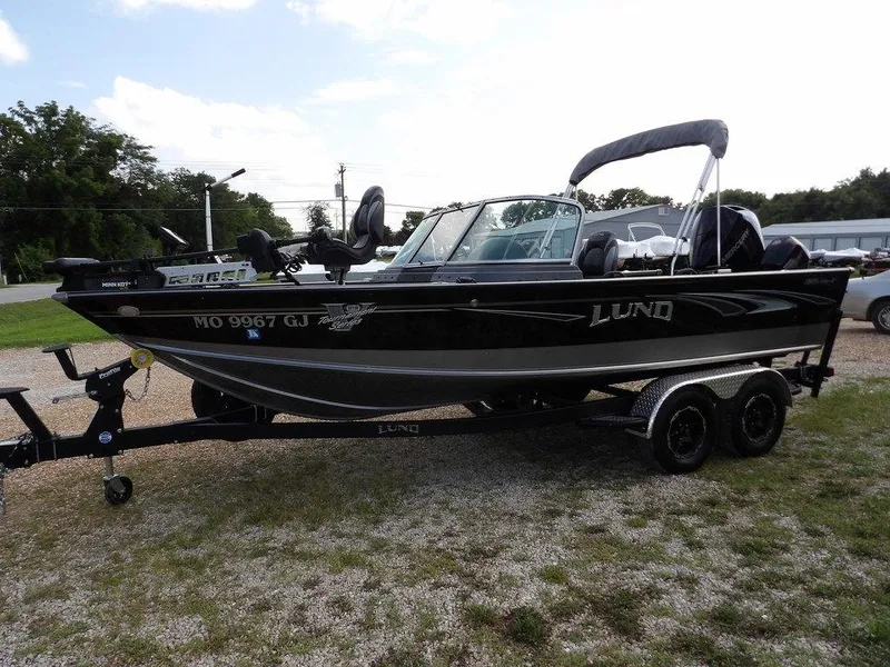 Slide: The Image of 2019 Lund 1975 Pro V Sport boat on trailer, parked outdoors. - 4