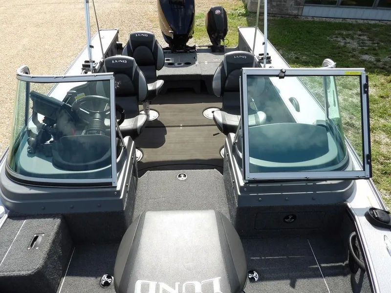 Slide: The Image of 2019 Lund 1975 Pro V Sport boat interior with seating and windshield. - 40