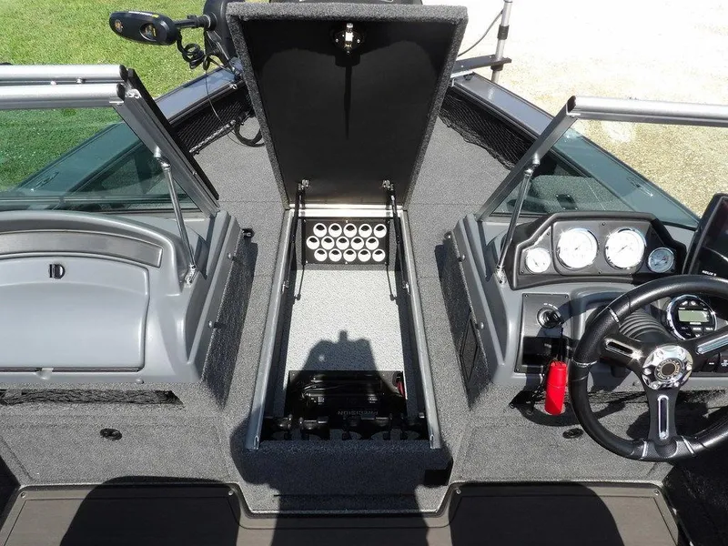 Slide: The Image of Interior of 2019 Lund 1975 Pro V Sport boat with open storage and dashboard controls. - 45
