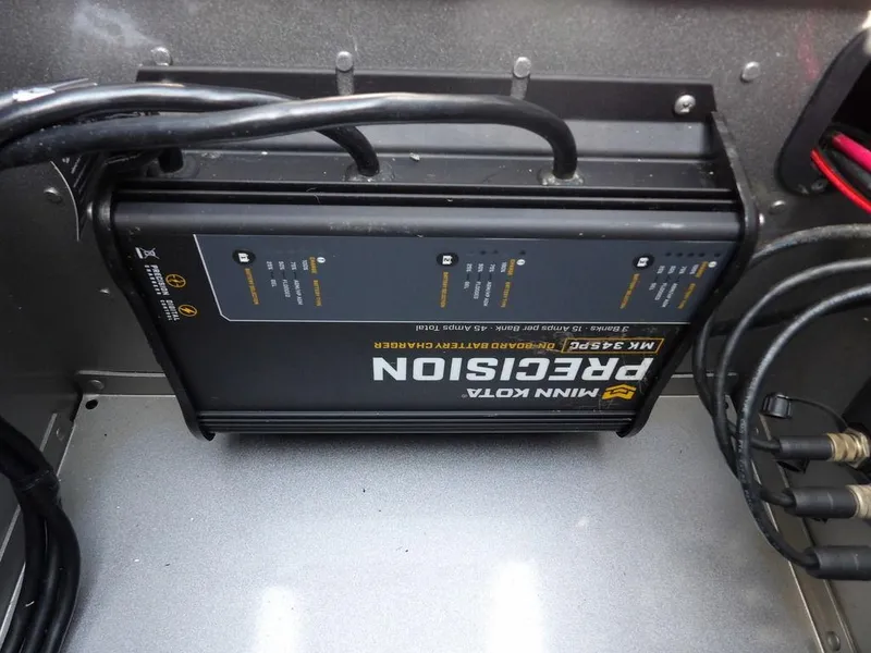 Slide: The Image of Minn Kota Precision onboard battery charger in a 2019 Lund 1975 Pro V Sport boat. - 47