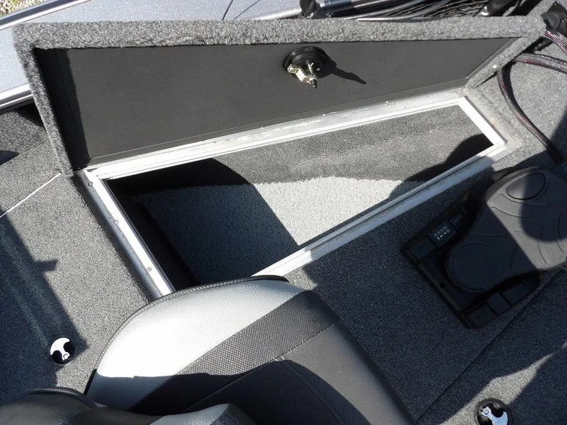 Slide: The Image of Open storage compartment in 2019 Lund 1975 Pro V Sport boat interior. - 48