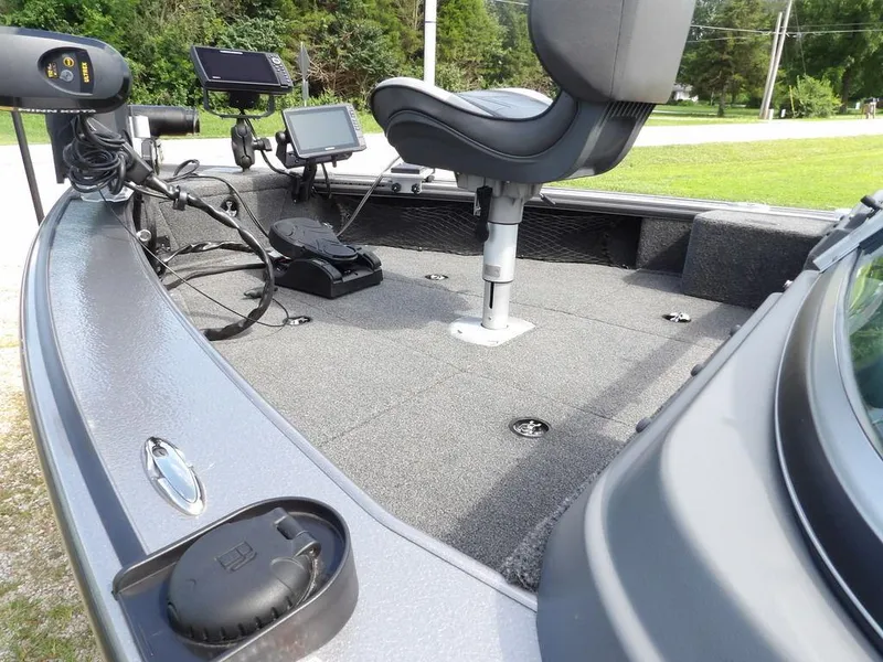 Slide: The Image of 2019 Lund 1975 Pro V Sport boat interior with fishing equipment and seating. - 8