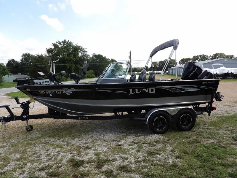 Slide: The Image of 2019 Lund 1975 Pro V Sport boat on trailer, parked outdoors. - 9