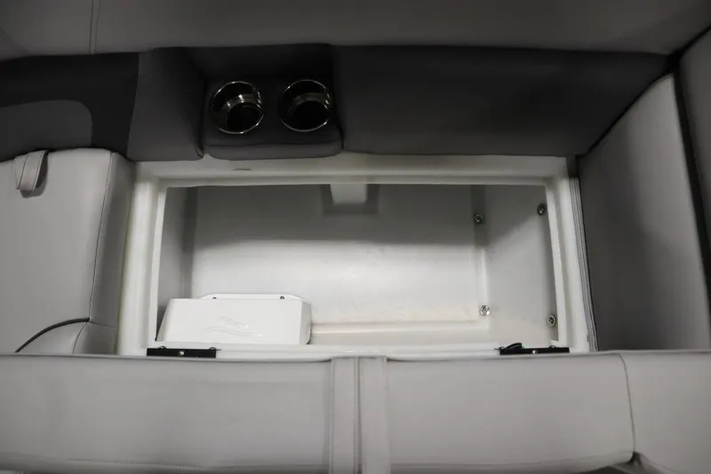 Slide: The Image of 2023 Trifecta 24UL CS 2.75 boat storage compartment with cup holders. - 15