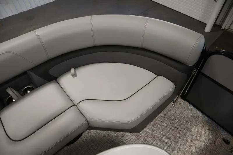 Slide: The Image of 2023 Trifecta 24UL CS 2.75 boat interior with gray cushioned seating. - 17