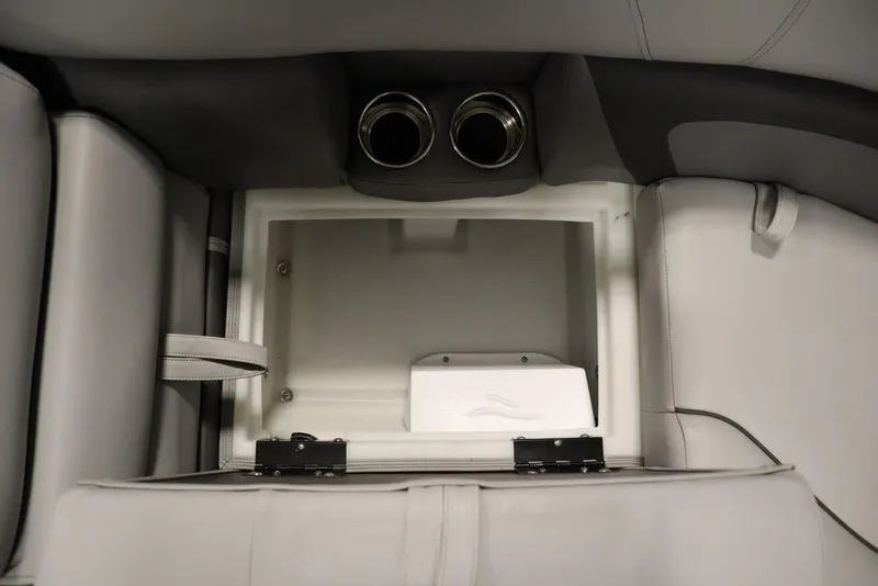 Slide: The Image of 2023 Trifecta 24UL CS 2.75 boat storage compartment with cup holders. - 20