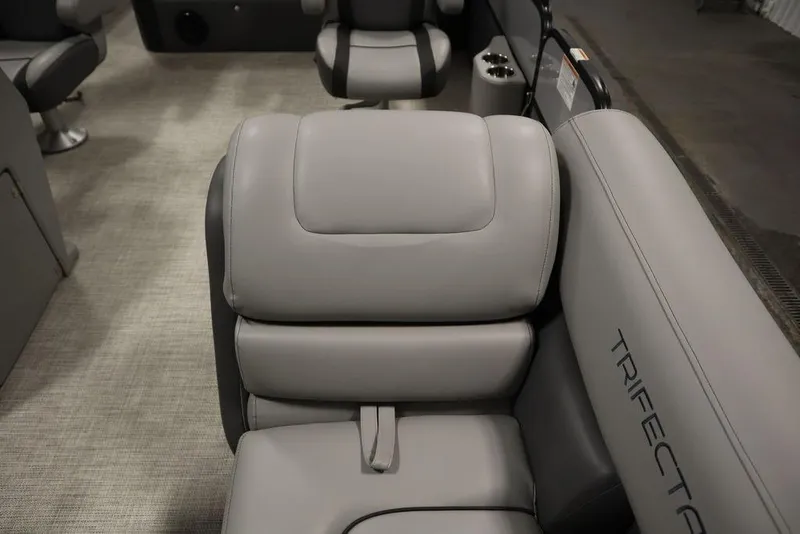 Slide: The Image of 2023 Trifecta 24UL CS 2.75 boat interior with gray leather seating. - 22