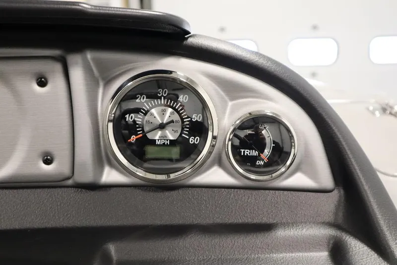 Slide: The Image of 2023 Trifecta 24UL CS 2.75 speedometer and trim gauge on dashboard. - 30