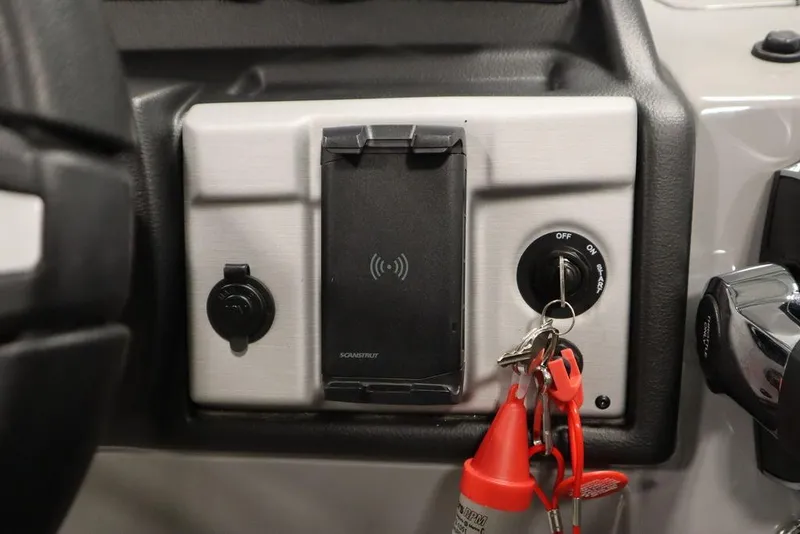 Slide: The Image of Control panel of 2023 Trifecta 24UL CS 2.75 with ignition switch and key. - 33