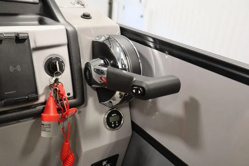 Slide: The Image of 2023 Trifecta 24UL CS 2.75 boat throttle control and ignition switch. - 36