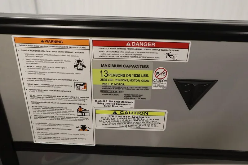 Slide: The Image of 2023 Trifecta 24UL CS 2.75 warning and capacity labels on boat. - 37