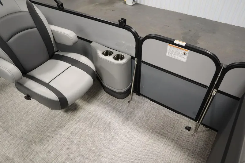 Slide: The Image of 2023 Trifecta 24UL CS 2.75 boat interior with gray seating and cup holders. - 41
