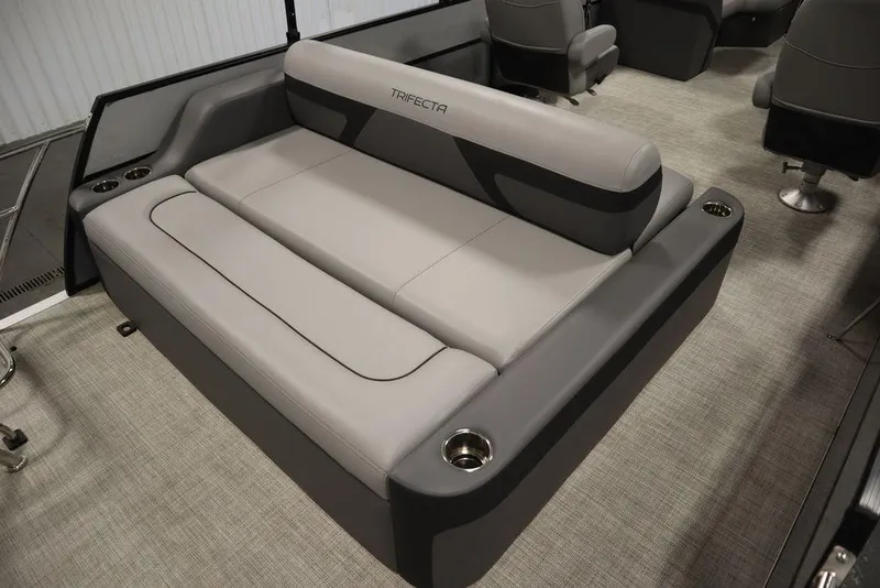 Slide: The Image of 2023 Trifecta 24UL CS 2.75 boat interior with luxurious seating and cup holders. - 44