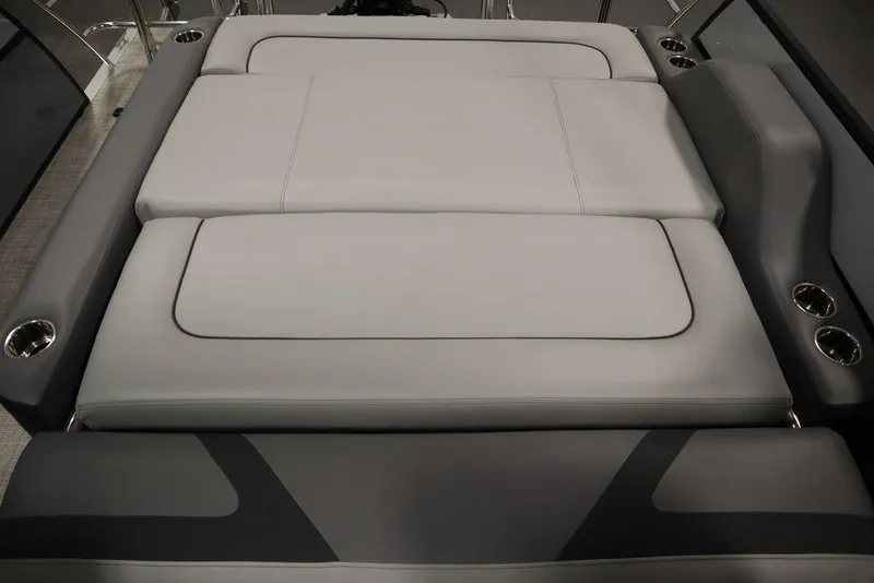 Slide: The Image of 2023 Trifecta 24UL CS 2.75 boat interior with gray cushioned seating. - 47