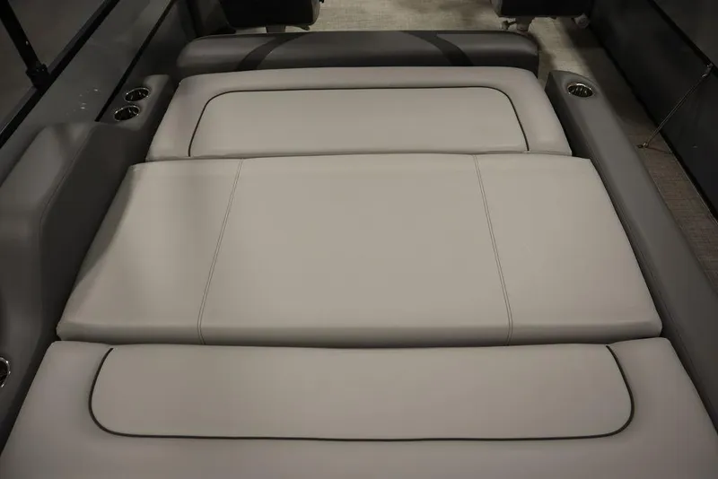 Slide: The Image of 2023 Trifecta 24UL CS 2.75 boat interior with gray cushioned seating. - 48