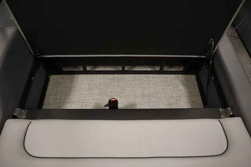 Slide: The Image of 2023 Trifecta 24UL CS 2.75 storage compartment with grey interior. - 49