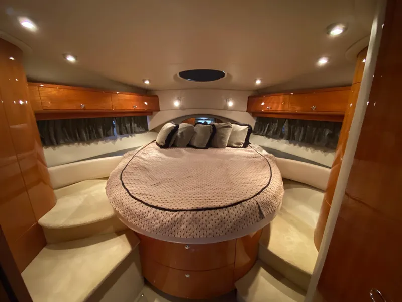 Slide: The Image of Luxurious bedroom in 2005 Regal Commodore 4260 yacht with round bed and ambient lighting. - 10