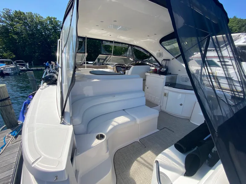 Slide: The Image of 2005 Regal Commodore 4260 yacht interior with seating and helm station. - 2