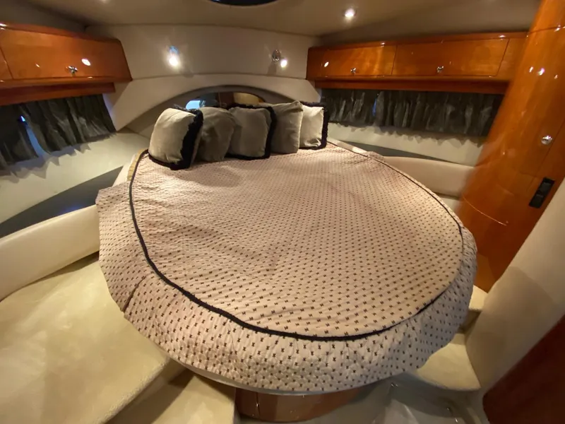 Slide: The Image of Luxurious bedroom interior of 2005 Regal Commodore 4260 yacht with plush bedding. - 9