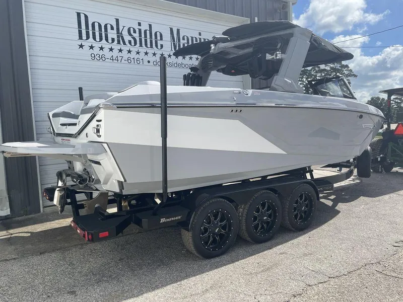 Slide: The Image of 2022 Nautique Super Air Nautique G23 boat on trailer at Dockside Marine. - 2