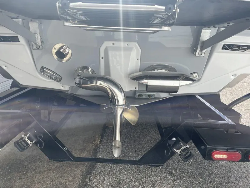 Slide: The Image of 2022 Nautique Super Air Nautique G23 boat stern with propeller and exhaust system. - 3