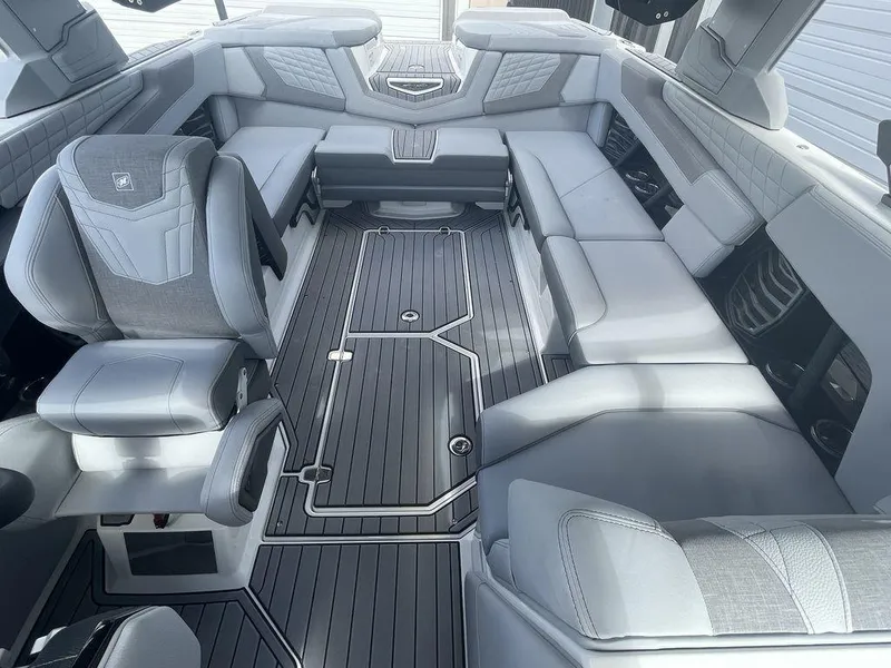 Slide: The Image of 2022 Nautique Super Air Nautique G23 interior with luxurious seating and modern design. - 8