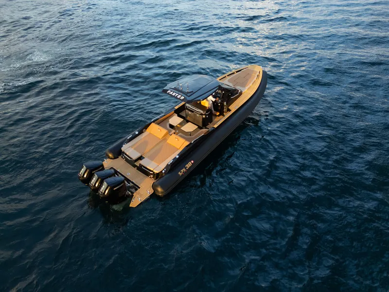Slide: The Image of 2025 SPX RIB 38 Sport boat on open water, featuring sleek design and powerful engines. - 1