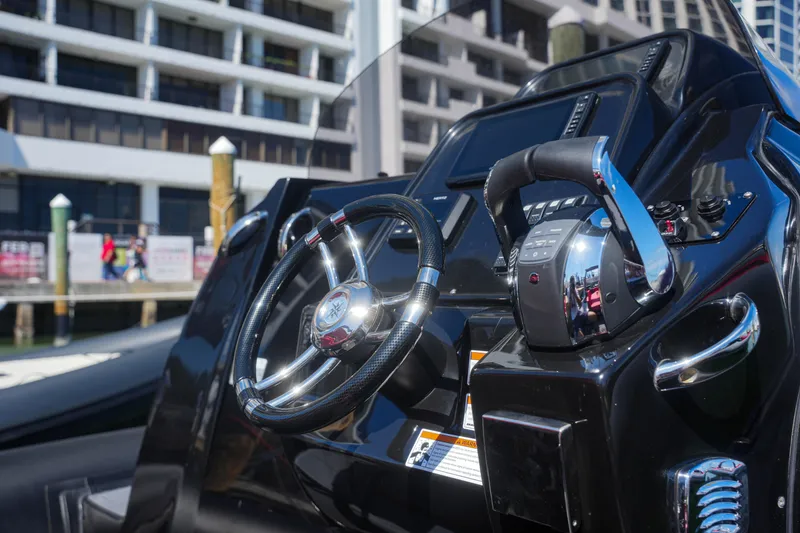 Slide: The Image of Control panel of the 2025 Sea Prop COMFORT 33 boat docked at a marina. - 12