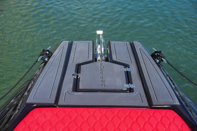 Slide: The Image of Bow of Sea Prop COMFORT 33 boat, 2025 model, with red and black deck. - 17