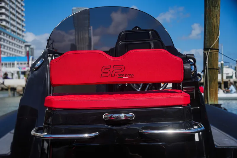Slide: The Image of Sea Prop COMFORT 33 boat, 2025 model, featuring a red seat with SP logo. - 6