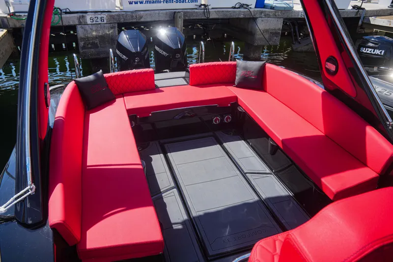 Slide: The Image of Sea Prop COMFORT 33 (2025) boat with red seating and twin Suzuki outboard motors. - 8