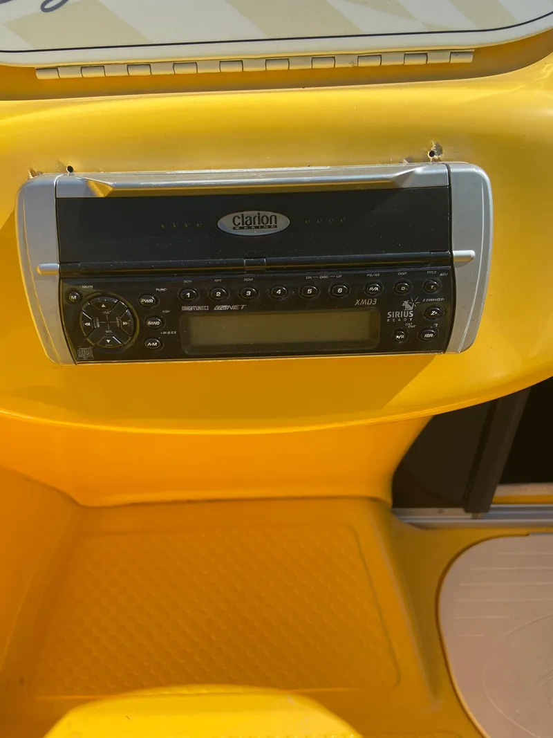 Slide: The Image of 2001 Baja H2X boat dashboard with Clarion stereo system. - 12