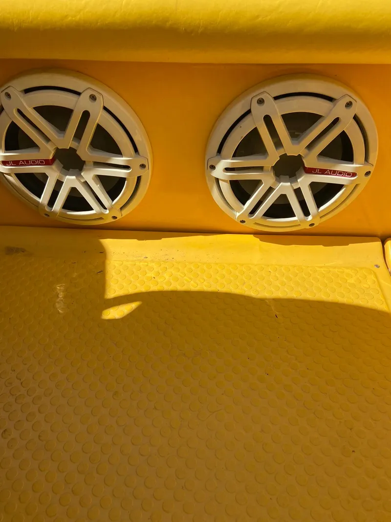 Slide: The Image of Close-up of 2001 Baja H2X boat speakers on yellow deck. - 17