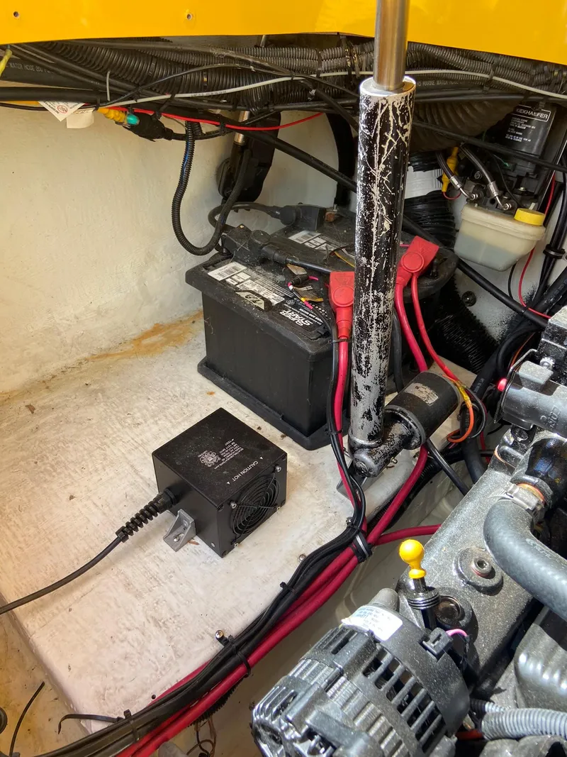 Slide: The Image of 2001 Baja H2X boat engine compartment with battery and wiring. - 27