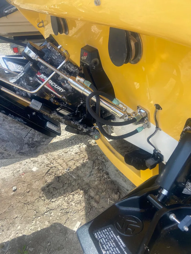 Slide: The Image of 2001 Baja H2X boat with Mercury outboard motor, yellow hull. - 30